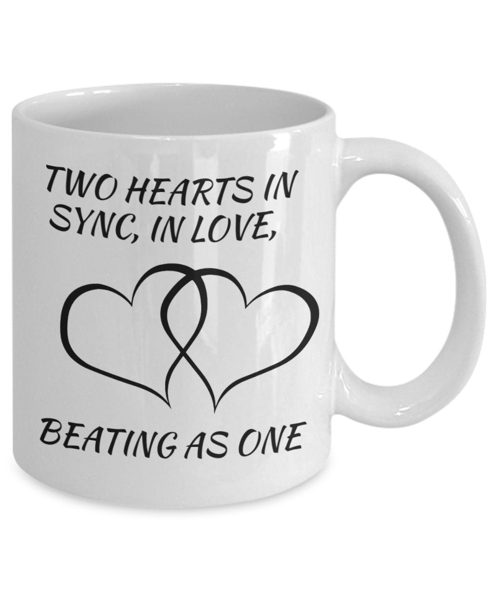 Two hearts in snyc love mug. Mug depicts harmony and love.