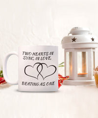 Load image into Gallery viewer, Two hearts in snyc love mug. Mug depicts harmony and love.
