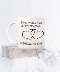 Load image into Gallery viewer, Two hearts in snyc love mug. Mug depicts harmony and love.
